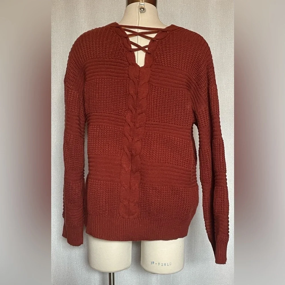 No Boundaries cable knit sweater with lattice back